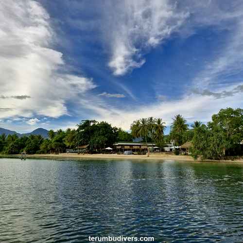 view of a beachfront resort from the diving boat Terumbu